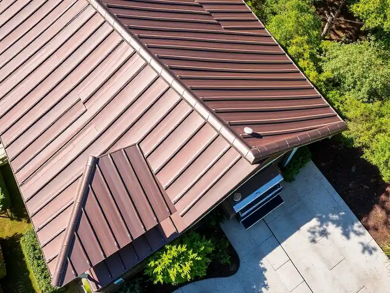 Illustration of close-up of materials and finishes of house with a standing-seam metal roof in a 1958-era home